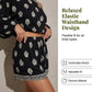 👗 50% DE DESCONTO AGORA! ✨ Macacão boémio com ombros à vista – Estampado, cintura elástica e bolsos laterais – Leve e respirável – perfeito para a praia, festivais ou viagens de verão 🌺