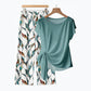 👚 50% DE DESCONTO AGORA! 🌸 Conjunto de top com laço lateral e calças estampadas para mulher – Corte solto e ajustável, perfeito para as férias de verão ou para usar em resorts 👖