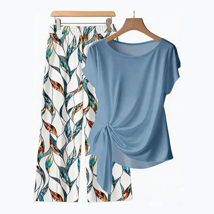 👚 50% DE DESCONTO AGORA! 🌸 Conjunto de top com laço lateral e calças estampadas para mulher – Corte solto e ajustável, perfeito para as férias de verão ou para usar em resorts 👖